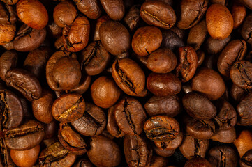 Natural background for Cafe menu or brochure template - macro photo of brown roasted coffee beans, close up