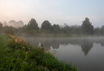 Fototapeta premium Mists over the ponds on Guldowy in Cieszyn against the background of the sky at dawn