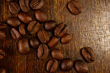 Natural background for Cafe menu or brochure template - macro photo of brown roasted coffee beans, close up