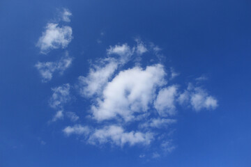 Naklejka na ściany i meble Background of blue sky and white clouds