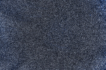 Gray surface with fine texture and white dots. Abstract neutral background for design. Backdrop
