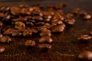 Natural background for Cafe menu or brochure template - macro photo of brown roasted coffee beans, close up