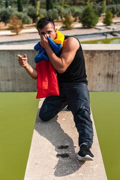 Bipoc dancer seated on rooftop