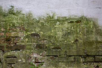Ancient mossy monastery wall, brickwork, blurred background