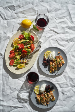 Mediterranean dishes and beverages on table