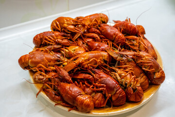 Delicious boiled crayfish/crawfish on a plate on a kitchen
