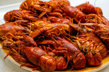Delicious boiled crayfish/crawfish on a plate on a kitchen
