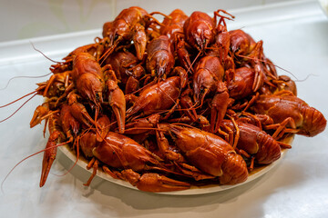 Delicious boiled crayfish/crawfish on a plate on a kitchen