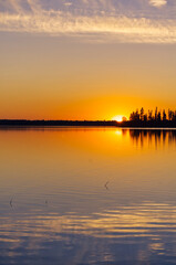 Fototapeta na wymiar Colourful Sunset at Astotin Lake, Elk Island National Park