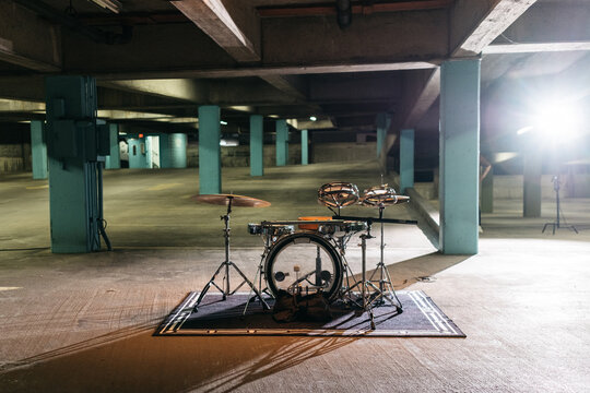 Drum kit set up in a parking garage