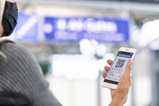 Travel: Woman Checks E-Ticket On Cell Phone