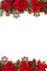 Frame of Christmas tree with balls, christmas gingerbread, flowers of red poinsettia and cones spruce on a white background with space for text. Top view, flat lay