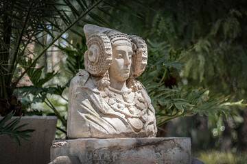 Lady of Elche in Elche's Huerto Del Cura botanical garden. Palm grove of Elche, Alicante, Spain. - obrazy, fototapety, plakaty