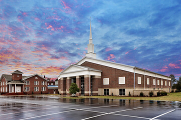 Gorgeous sunset or sunrise view of modern brick white church building