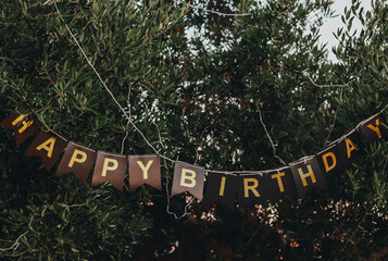 Festive lettering in green leaves