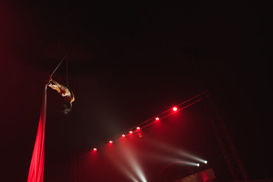 Gymnast Performing Acrobatic Trick In The Air

