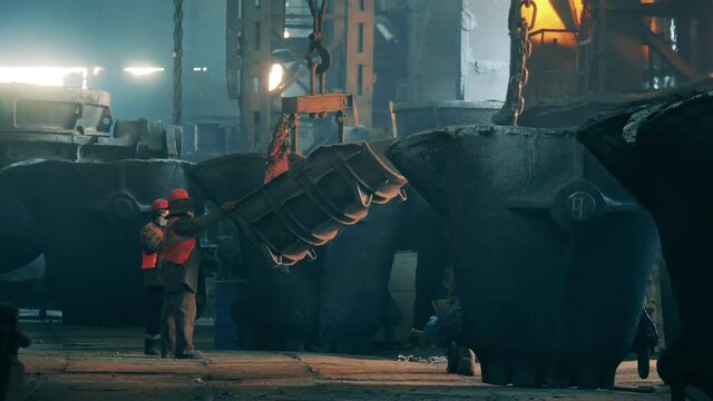 Metallurgists are working with steel carcasses