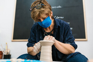 Potter working on the potter's wheel