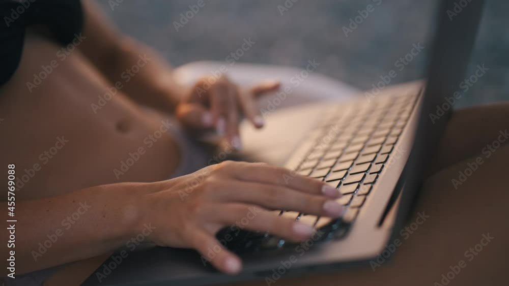 Poster a female freelancer is working on laptop near sea. programmer is coding and surfing on notebook. rem