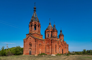 A church in the midst of dense grass. An abandoned church in Tatarstan, Russia. 