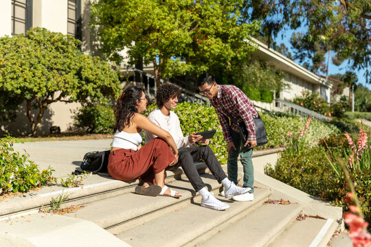 A Student Shows a Friend His Tablet