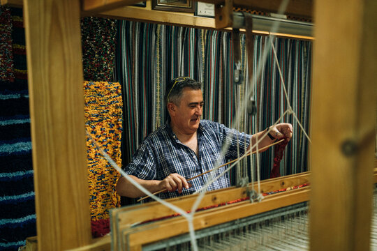 A Happy Worker Making the Warp