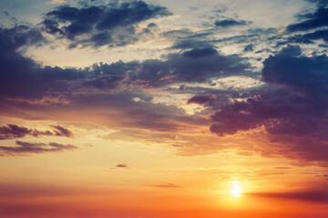 Naklejka na ściany i meble Beautiful colorful dramatic sky with clouds at sunset or sunrise