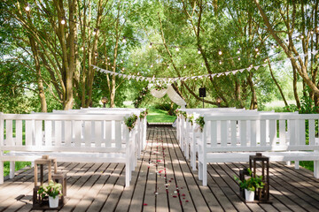 The beautiful area for the wedding ceremony is decorated with flowers and fabric