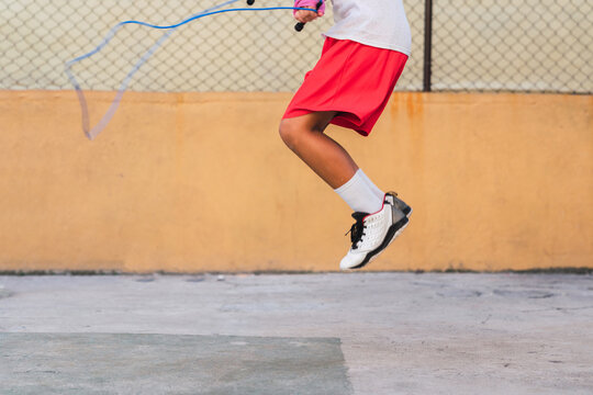 Kid skipping rope.