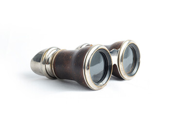 Antique binoculars on white background