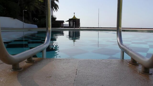 Swimming pool with no people at dawn