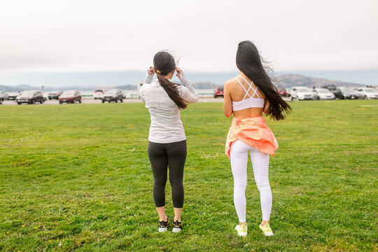 Unrecognizable Long hair sportswomen son park in city