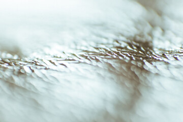 Beautiful abstract background made of material. The texture of aluminum foil. Soft focus. Macro...