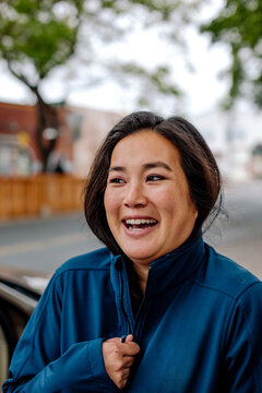 Smiling woman wearing blue jacket