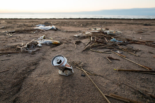 Used aluminum can on the shore 