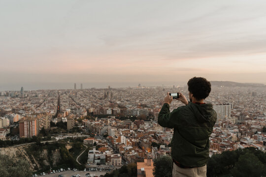 male silhouette  in front of Barcelona city view