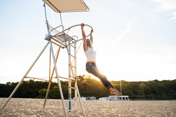 Active mature woman enjoying at beach