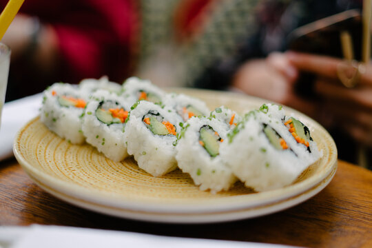 Sushi rolls with friends - Powered by Adobe