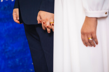 Newlyweds hands detail.