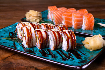 Sushi set with red fish on the table on blue dishes