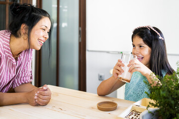 Happy family having breakfast in the morning