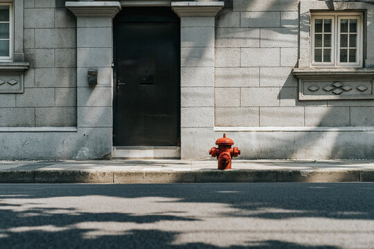 A red fire hydrant on the road