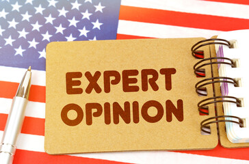 On the US flag lies a notebook with the inscription - expert opinio