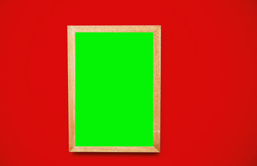 Empty green screen frame over red background.