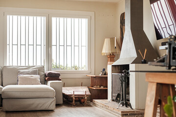 Cozy living room with sofa and elegant fireplace