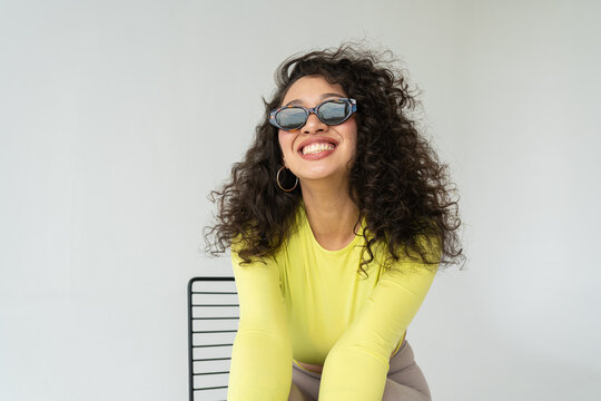 Young Happy Hispanic female in sunglasses 