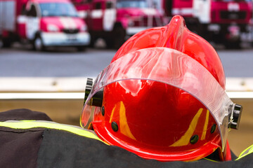 Firefighter uniform with red helmet. image of a red helmet of a fireman.