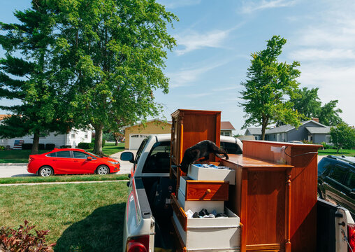 Furniture loaded in truck from moving out of house. 