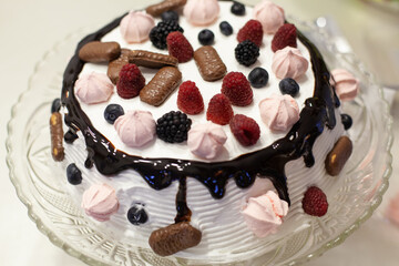 Tasty birthday fruit cake with chocolate.