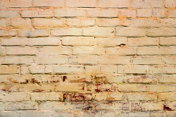 Texture of a brick wall with cracks and scratches which can be used as a background